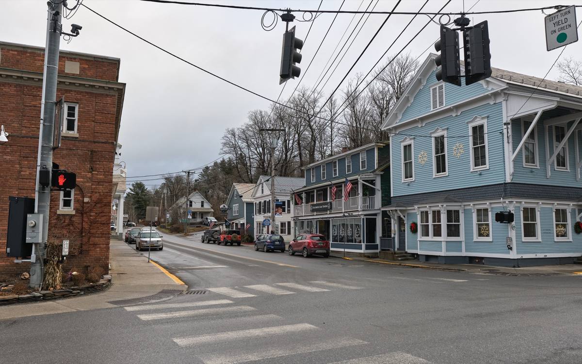 Wilmington's central crossroads where Route 9 meets Route 100, clapboard storefronts hung with holiday wreaths on a damp December day