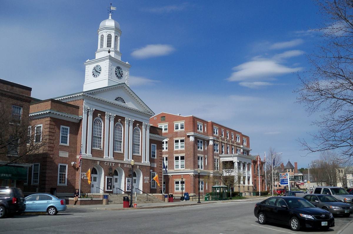 Lebanon's City Hall clock tower and the brick civic blocks around Colburn Park on a clear spring day